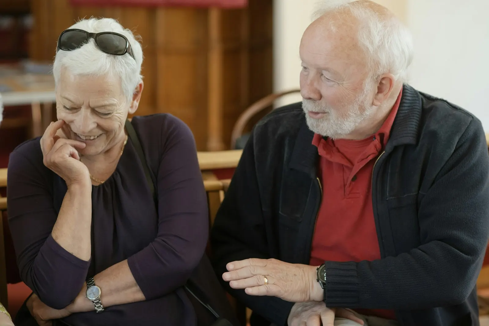 Older couple smiling while talking